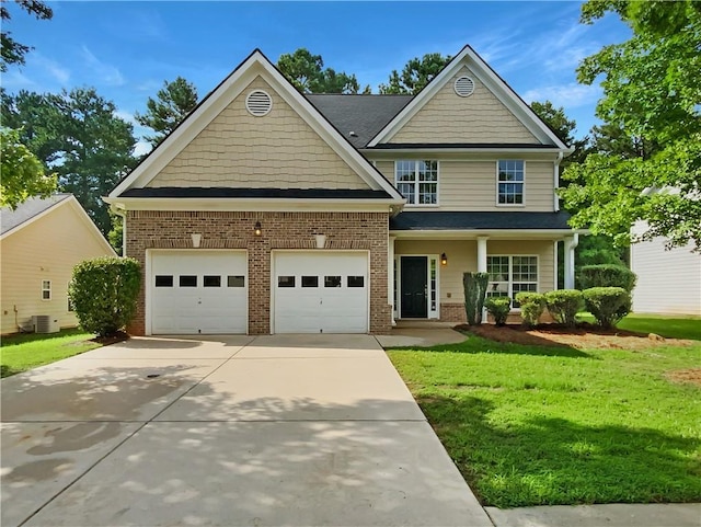 craftsman inspired home with a front yard and central AC unit