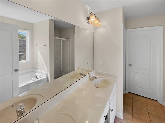 bathroom with tile patterned flooring, vanity, and plus walk in shower