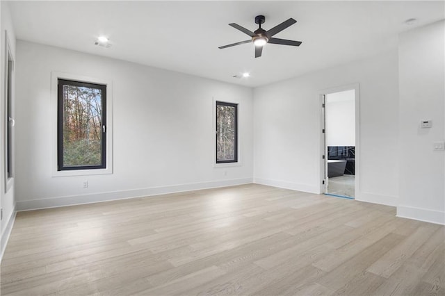 unfurnished room featuring ceiling fan and light wood-type flooring