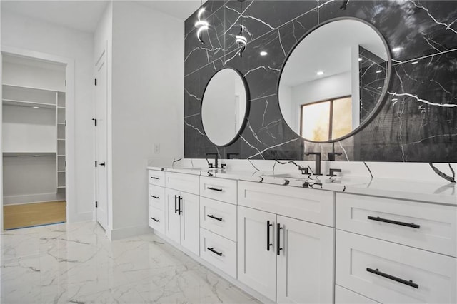 bathroom featuring tile walls and vanity