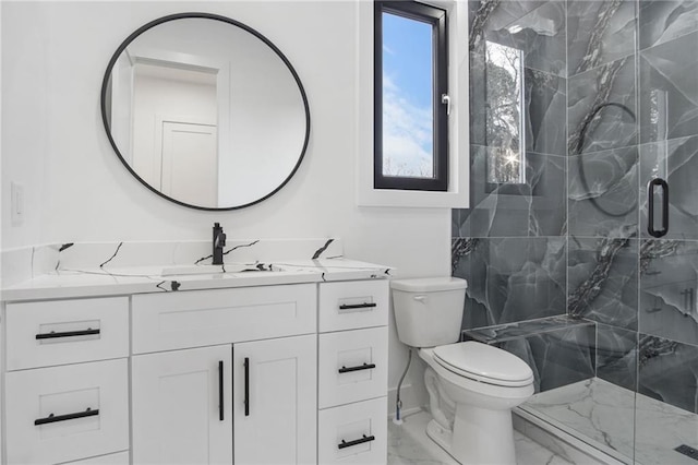 bathroom with toilet, a shower with shower door, and vanity