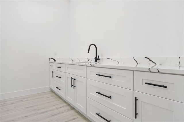 bathroom with sink and hardwood / wood-style floors