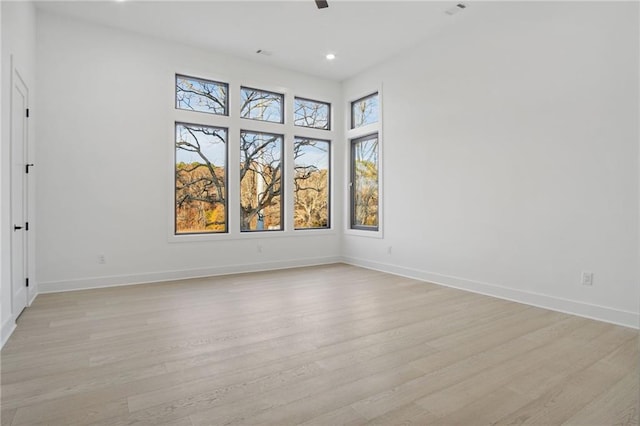 unfurnished room with light wood-type flooring