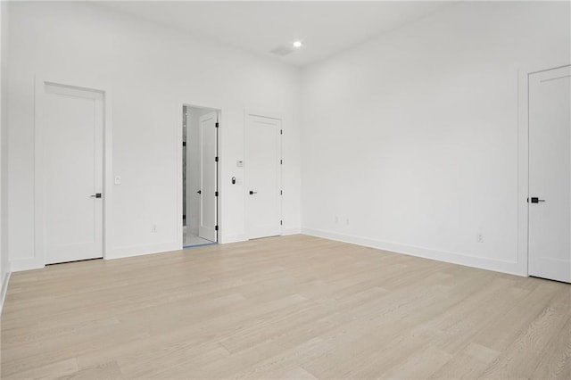 spare room featuring light hardwood / wood-style floors