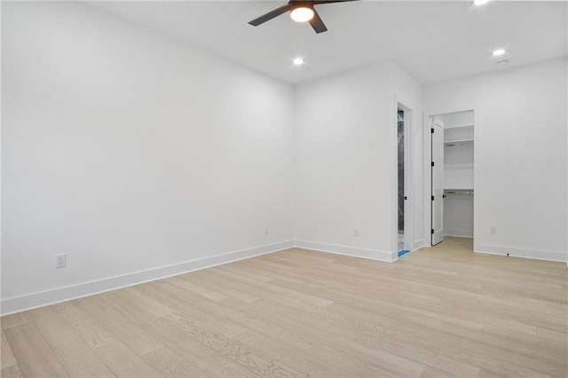 unfurnished room featuring ceiling fan and light wood-type flooring