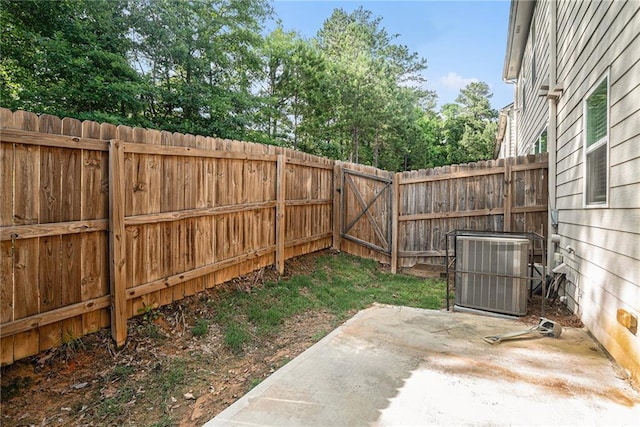 2909 Emme Ct, Conyers, GA 30094 - fenced backyard with central AC and a patio