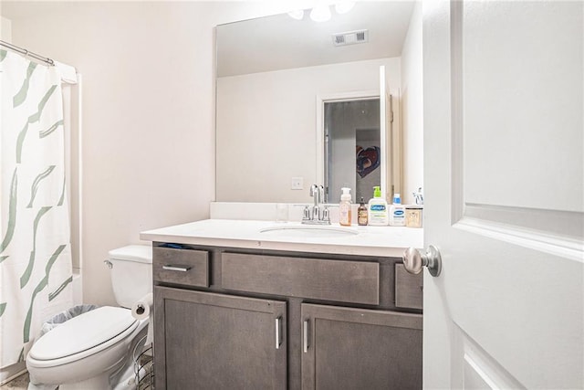 2909 Emme Ct, Conyers, GA 30094 - full bathroom with vanity, toilet, and curtained shower
