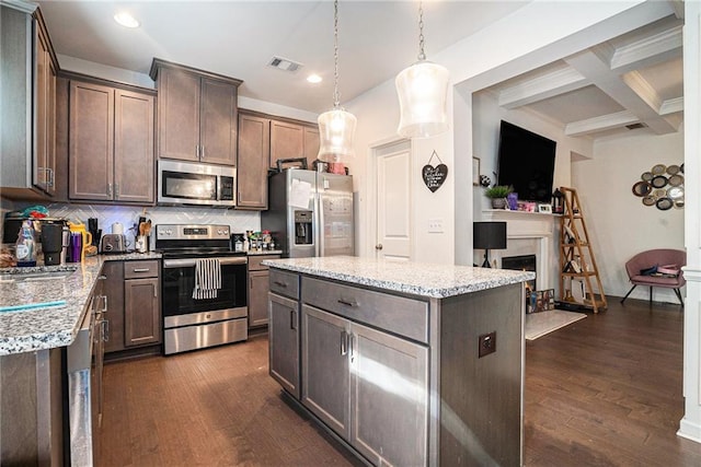 2909 Emme Ct, Conyers, GA 30094 - kitchen with appliances with stainless steel finishes, tasteful backsplash, beamed ceiling, recessed lighting, and dark wood finished floors
