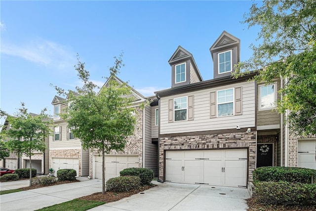 2909 Emme Ct, Conyers, GA 30094 - view of property featuring driveway, stone siding, and a garage