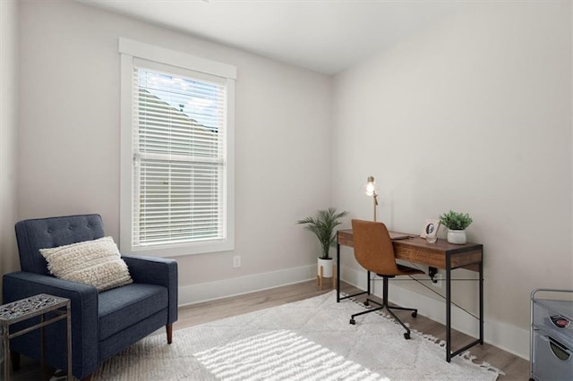 office space featuring wood finished floors and baseboards