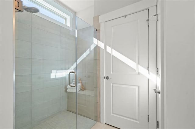 bathroom with a shower stall