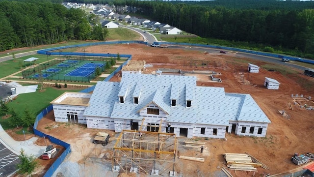 birds eye view of property with a wooded view