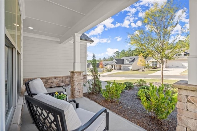 view of patio / terrace featuring a residential view and an outdoor hangout area