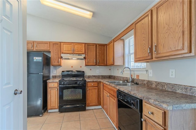 kitchen with lofted ceiling, sink, light tile patterned floors, tasteful backsplash, and black appliances