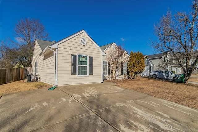 view of front of property with a patio and central AC unit