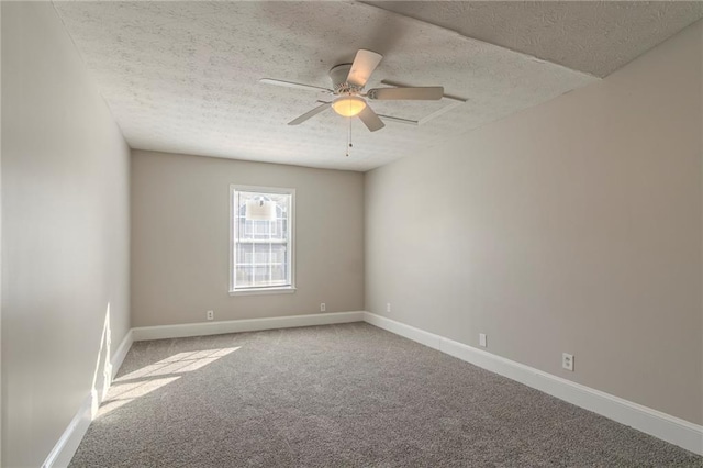 spare room with ceiling fan, carpet floors, and a textured ceiling