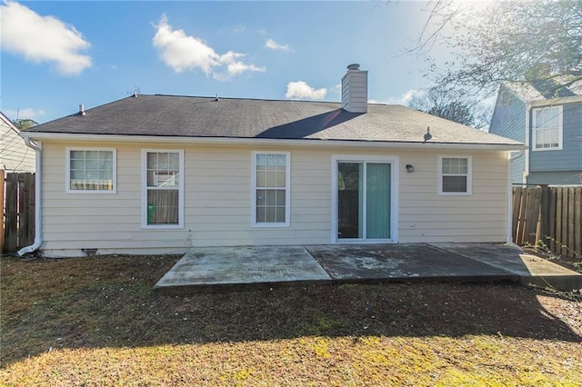 back of house with a patio