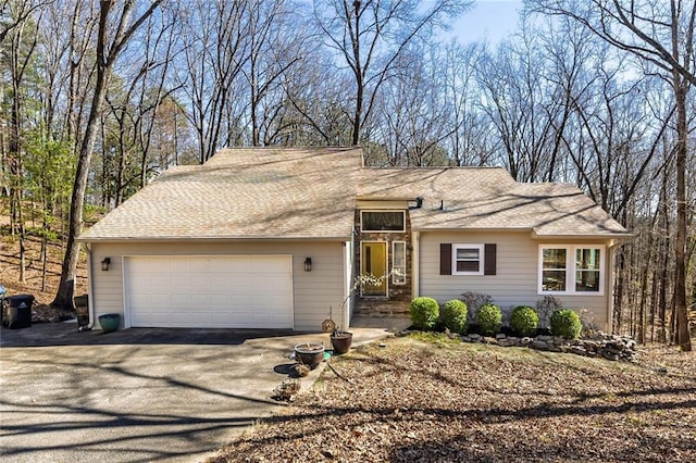 view of front of property featuring a garage and driveway