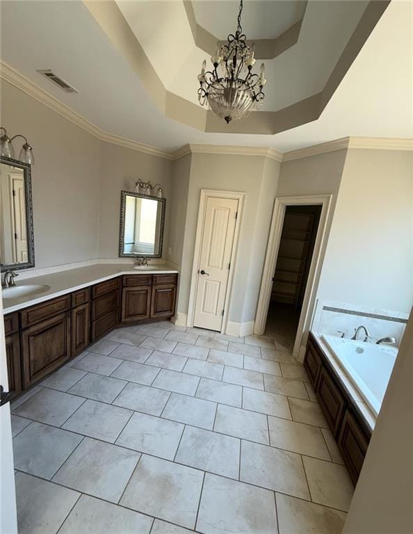 full bath with crown molding, a tray ceiling, visible vents, and a sink