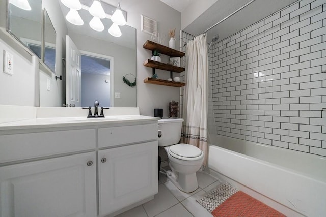 full bathroom with vanity, toilet, tile patterned floors, and shower / bath combo with shower curtain