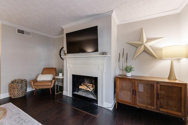 living room featuring crown molding, a textured ceiling, and dark hardwood / wood-style floors