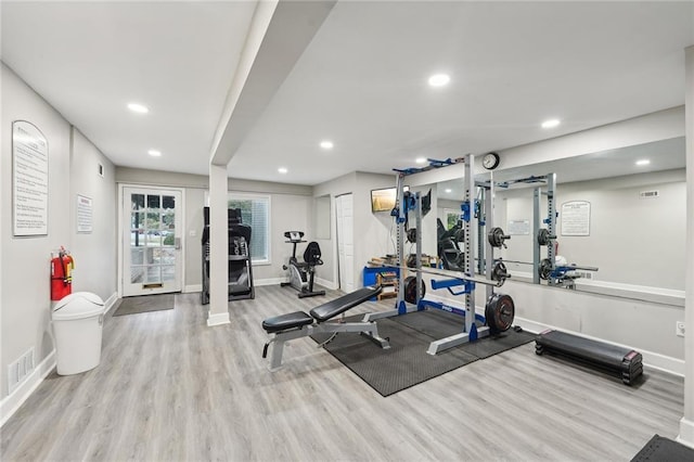 exercise area with light wood-type flooring