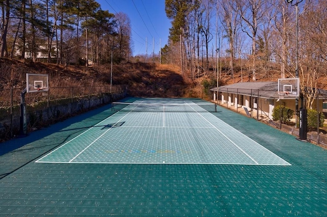 view of sport court featuring basketball hoop