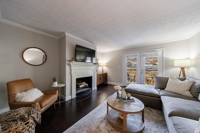 living room featuring dark wood-type flooring, a textured ceiling, crown molding, and french doors