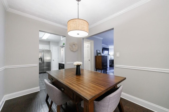 dining room featuring crown molding and dark wood-type flooring