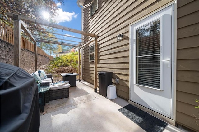 view of patio / terrace featuring fence, outdoor lounge area, and a pergola