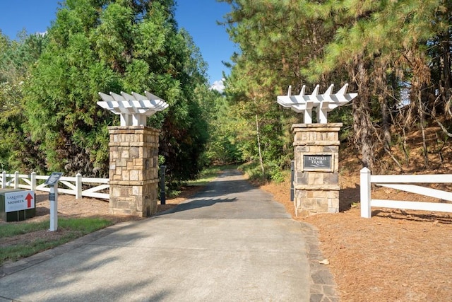 view of gate featuring fence