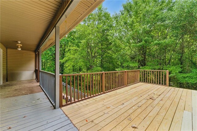 wooden terrace with a forest view