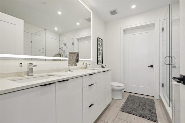 788 W Marietta St NW Unit 403, Atlanta, GA 30318 - bathroom with a shower stall, double vanity, recessed lighting, and tile patterned flooring