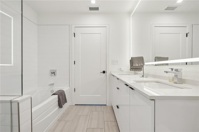 788 W Marietta St NW Unit 403, Atlanta, GA 30318 - full bathroom featuring double vanity and washtub / shower combination
