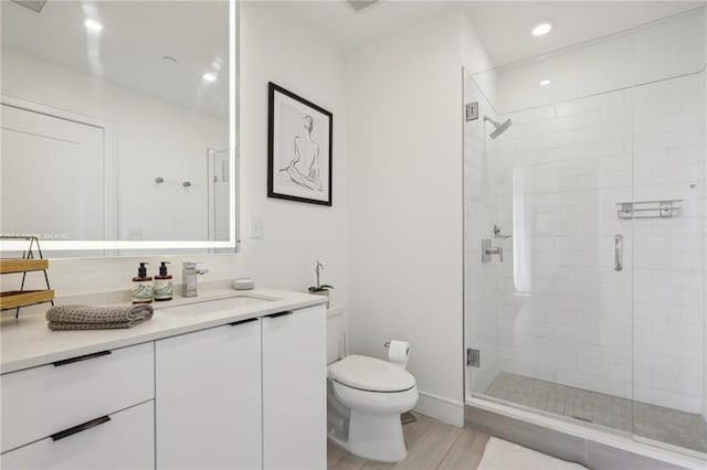 788 W Marietta St NW Unit 403, Atlanta, GA 30318 - bathroom featuring vanity, a shower stall, wood finished floors, and recessed lighting