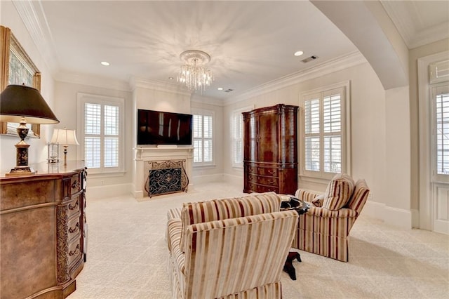 living room with crown molding, light colored carpet, and an inviting chandelier