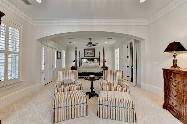 bedroom featuring light colored carpet and ornamental molding