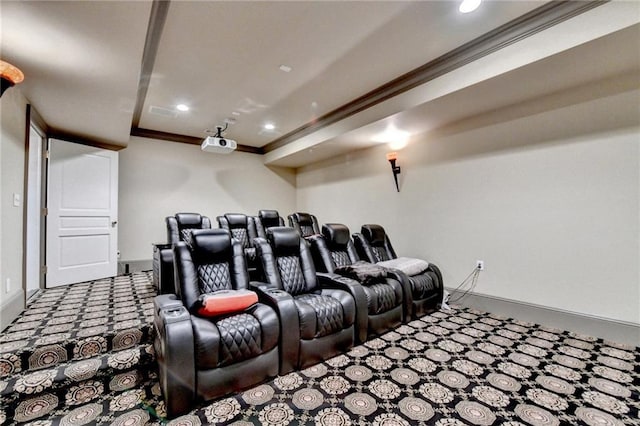 carpeted home theater featuring crown molding