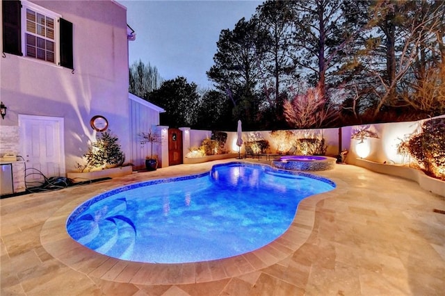 view of swimming pool with a patio area and an in ground hot tub