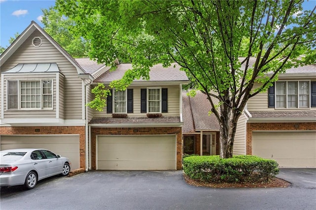 2908 Woodruff Dr SE, Smyrna, GA 30080 - multi unit property with a garage, driveway, and brick siding