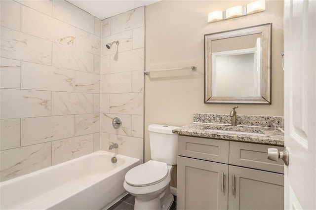 bathroom with toilet,  shower combination, and vanity