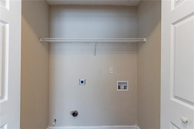 laundry room with hookup for an electric dryer, gas dryer hookup, and washer hookup