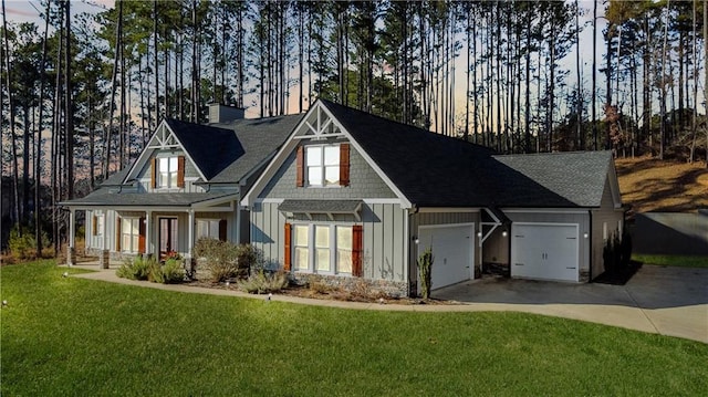 view of front of property featuring covered porch and a lawn