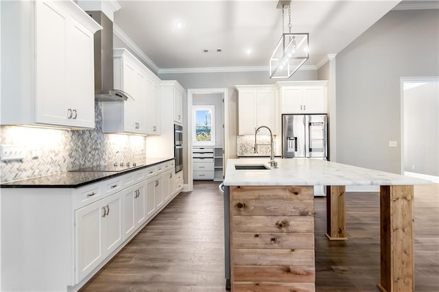 kitchen featuring tasteful backsplash, stainless steel appliances, sink, pendant lighting, and white cabinetry