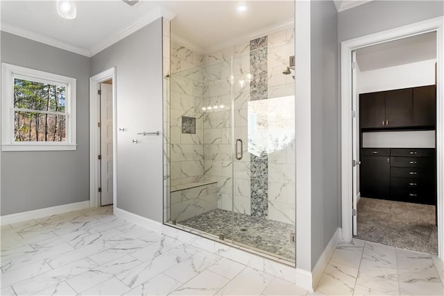 bathroom featuring a shower with door and crown molding