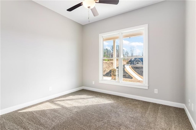 empty room with carpet flooring and ceiling fan