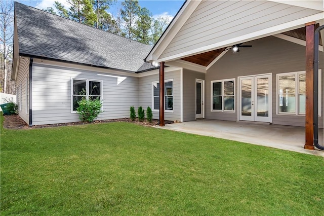 back of property with a lawn, ceiling fan, and a patio