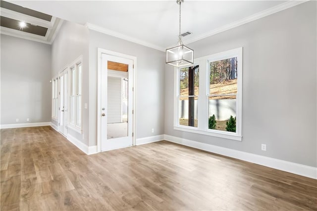 spare room with wood-type flooring, ornamental molding, and french doors