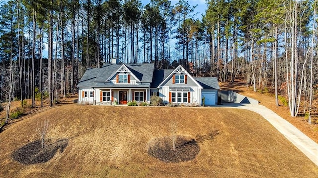 view of front of house featuring a porch and a garage