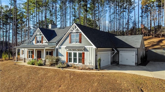 craftsman house with a garage and covered porch